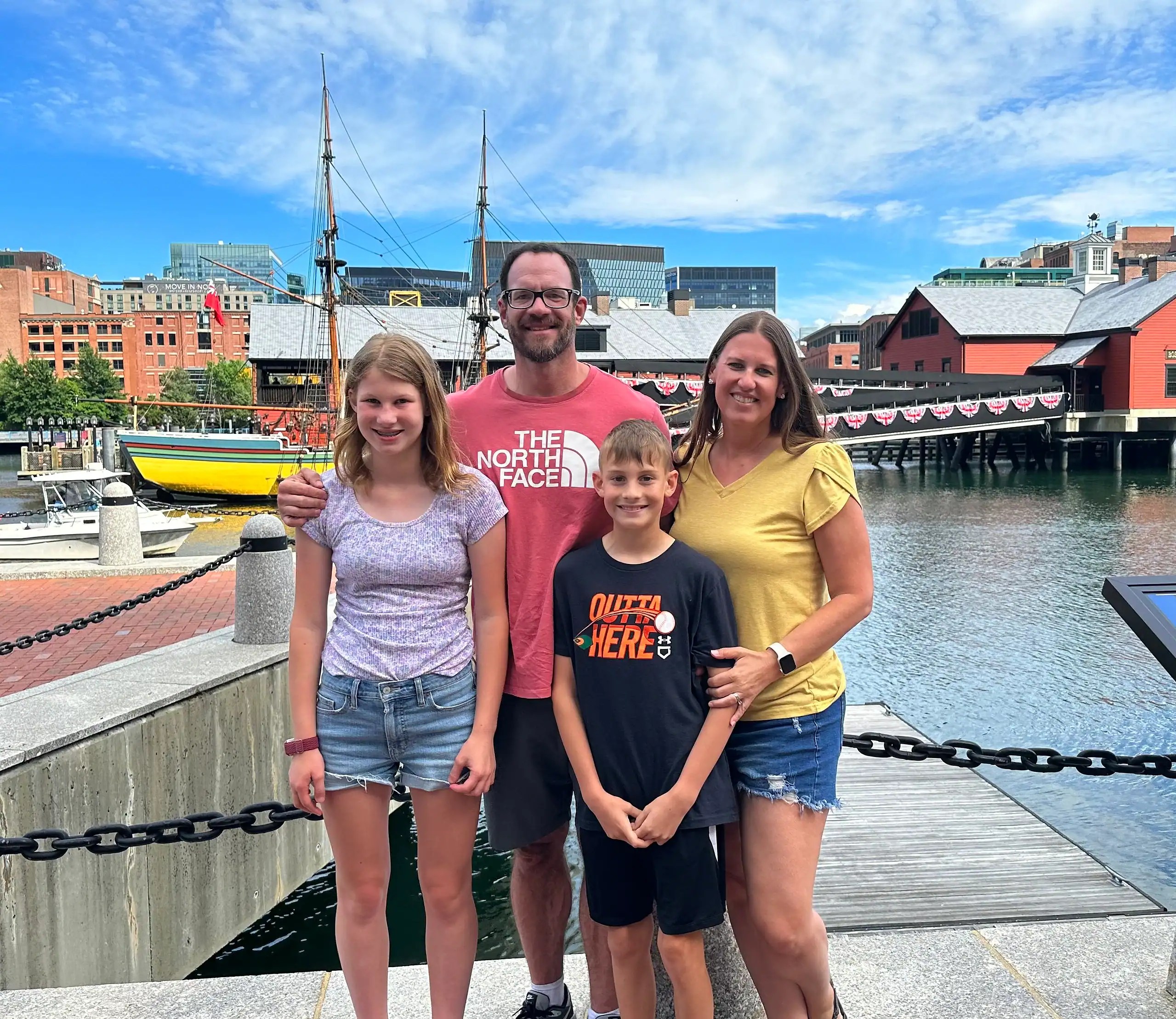 Family visiting Boston Harbor near the Boston Tea Party Ships — one of the best things to do in Boston with teens.