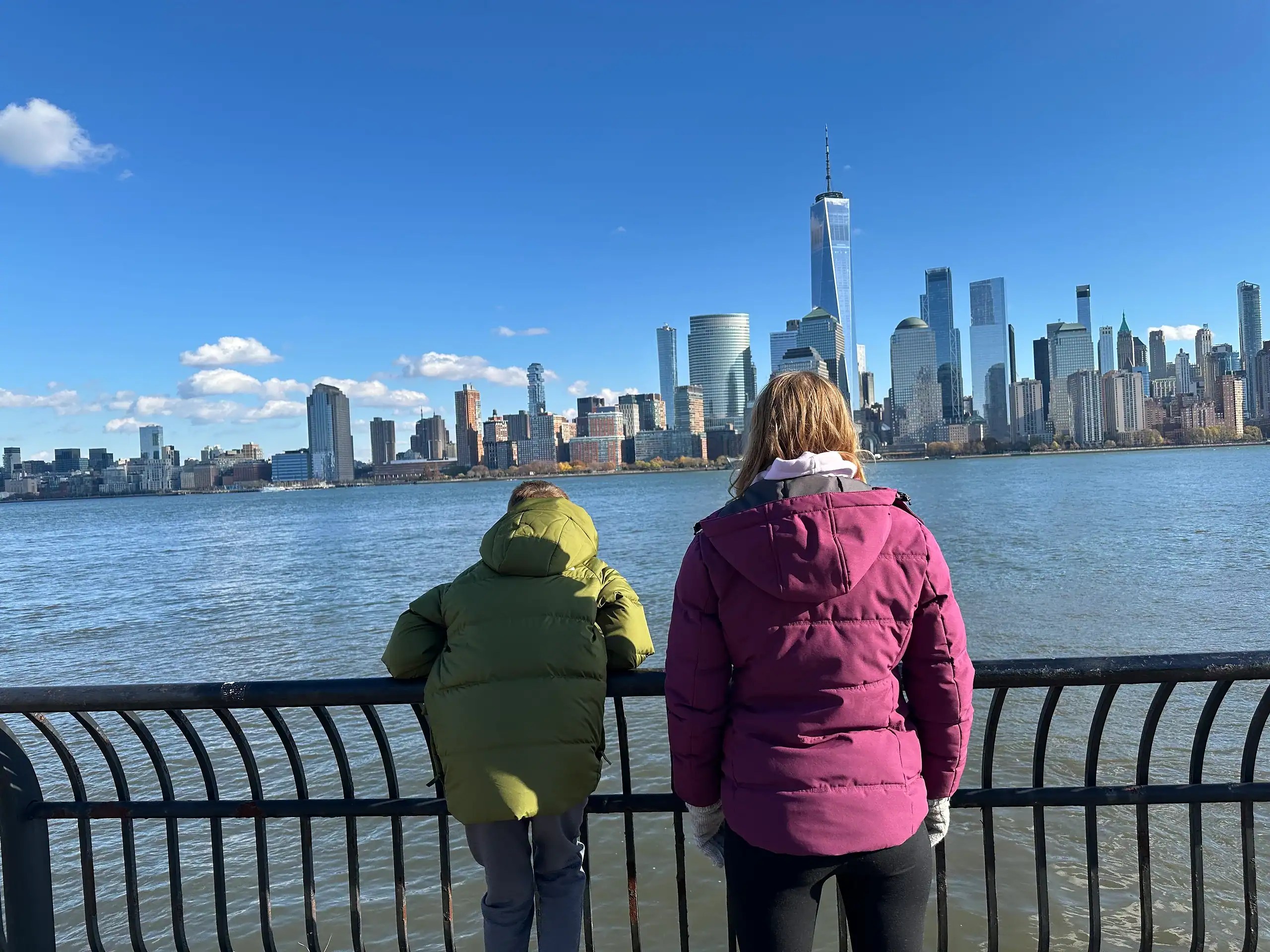 Kids looking at the New York City skyline during our family visit to New York City on points