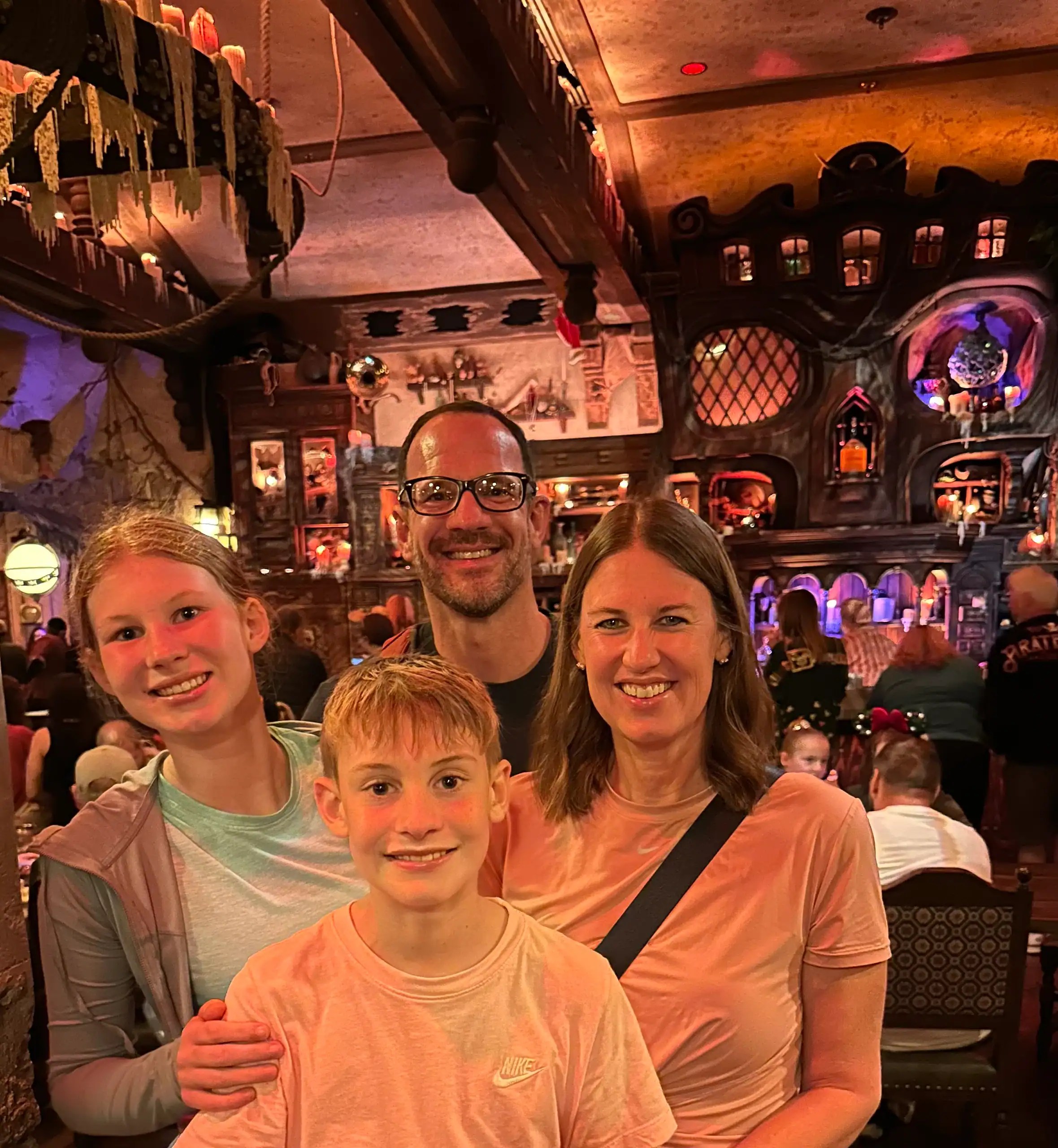 Family enjoying dinner at a themed restaurant at Disney World