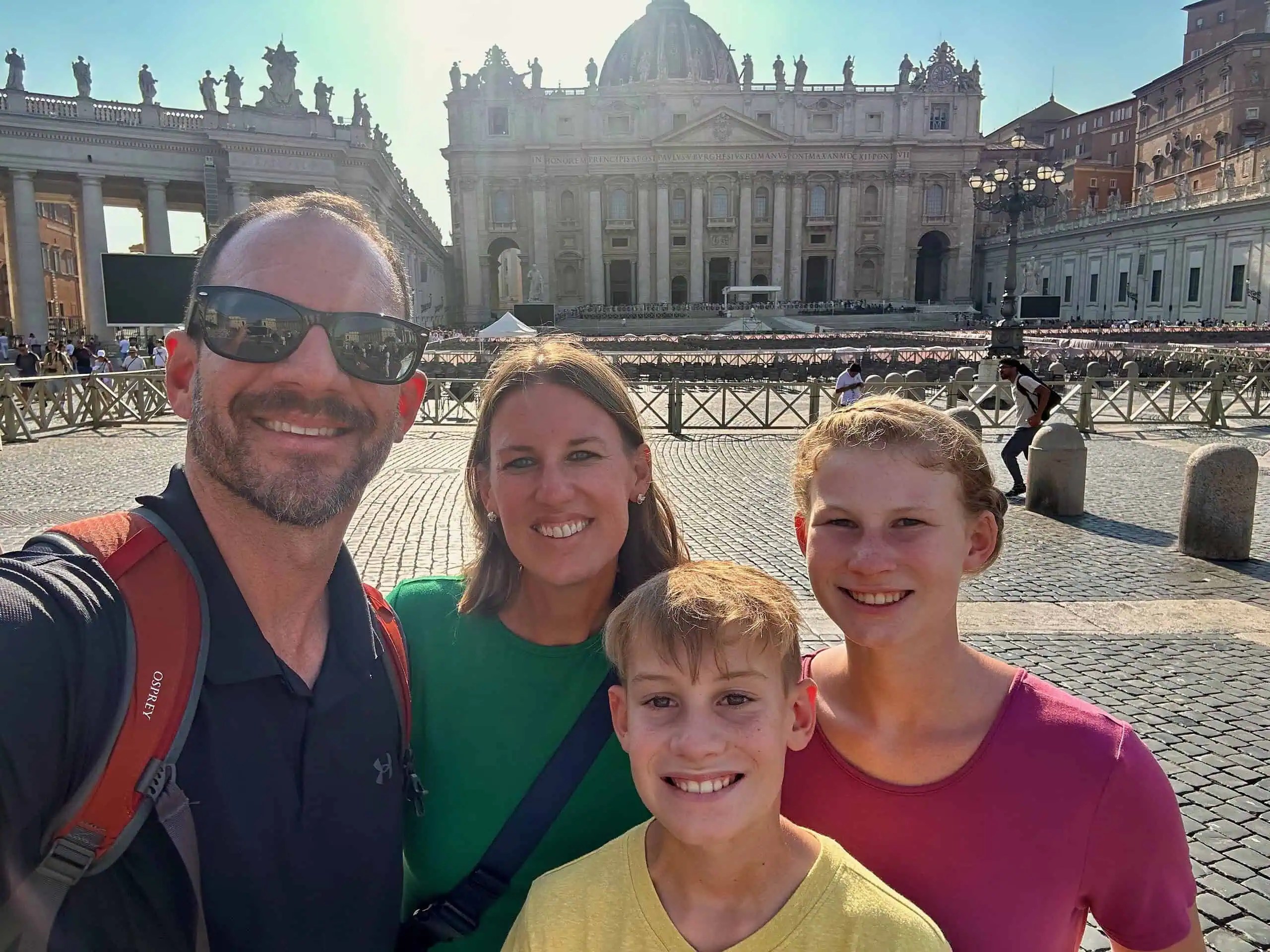 Family visiting the Vatican with tweens and teens in St. Peter’s Square