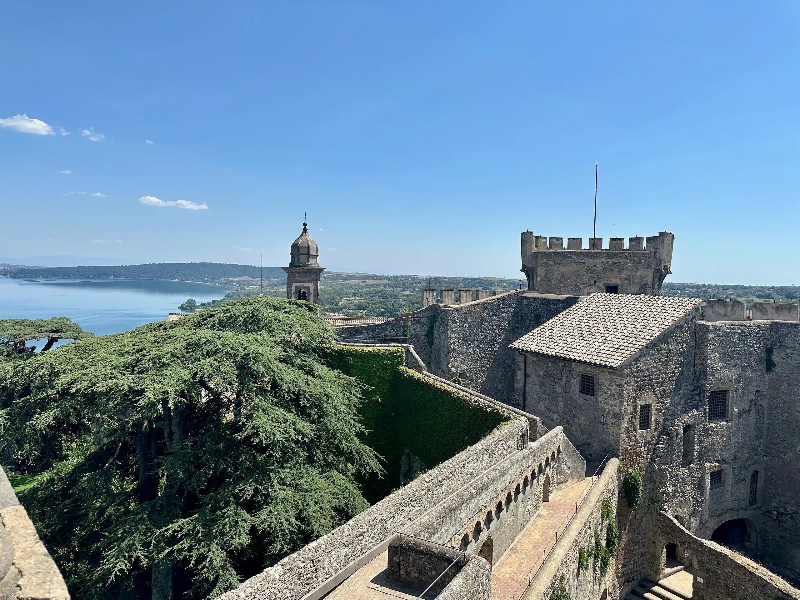 View of Castello Odescalchi in Bracciano with Lake Bracciano in the background on a sunny day