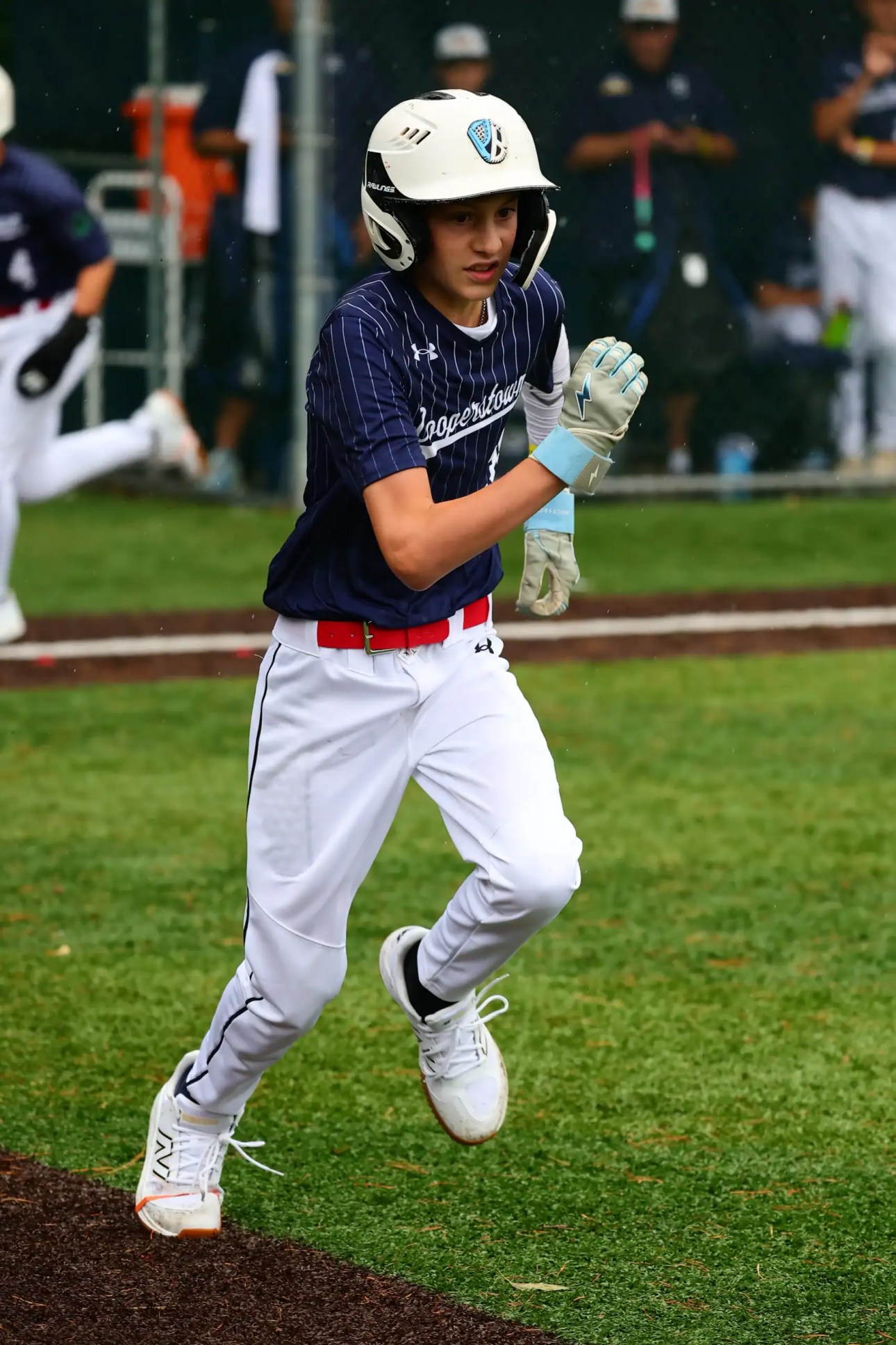 12U baseball player running the bases during a game at Cooperstown All Star Village