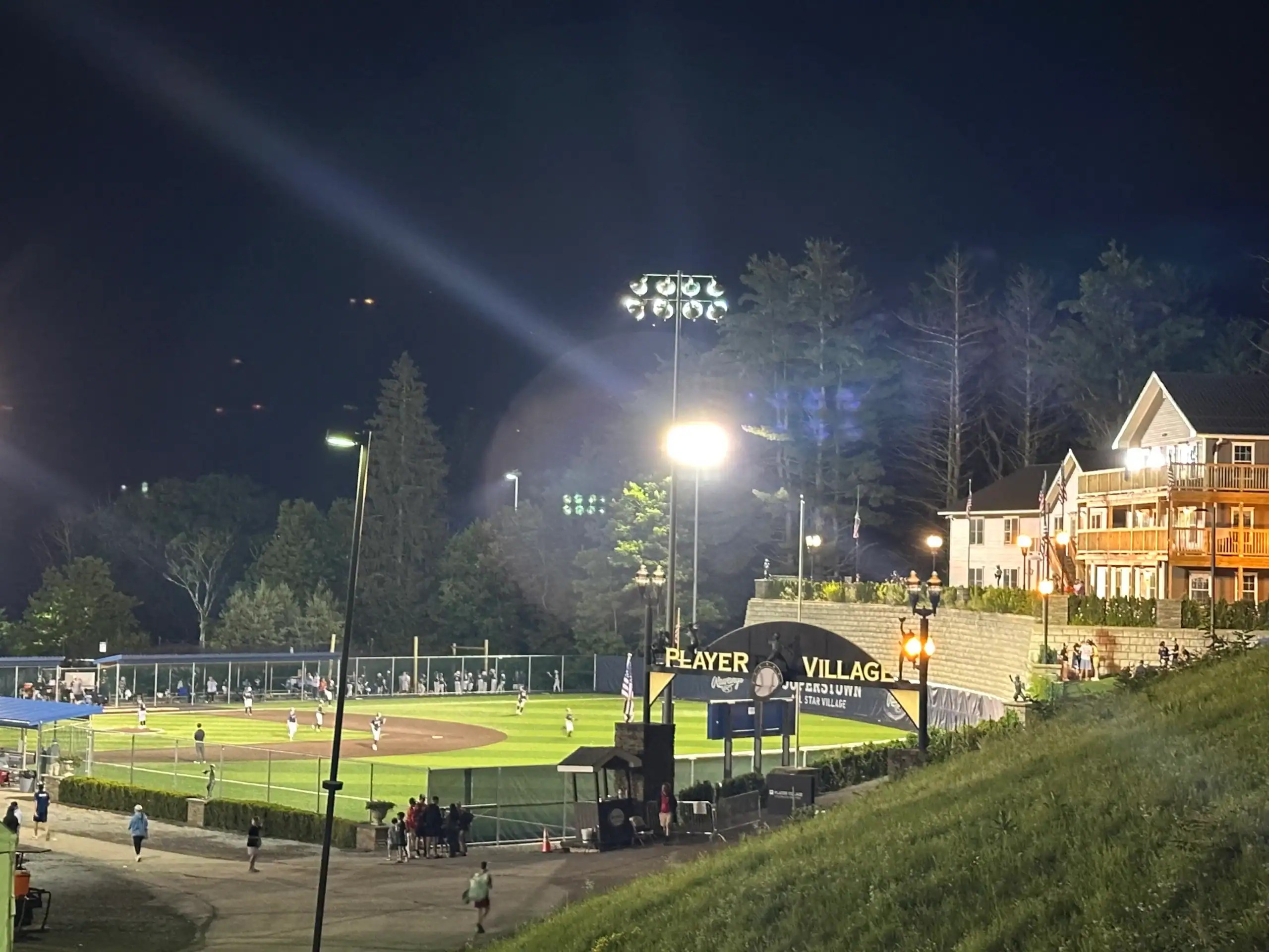 Player Village during a Cooperstown baseball tournament with lighted baseball fields and players staying on site at Cooperstown All Star Village.