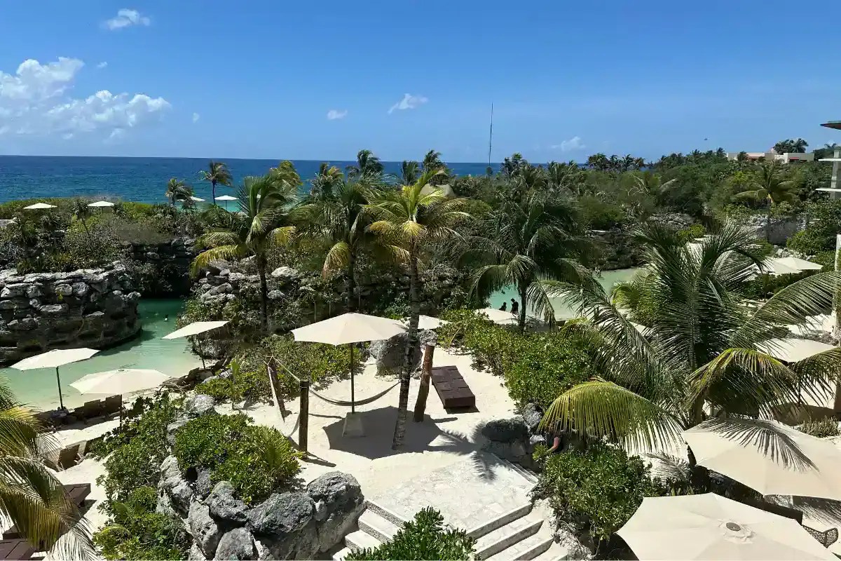 Hotel Xcaret Mexico resort with turquoise water, beach, hammocks and ocean views