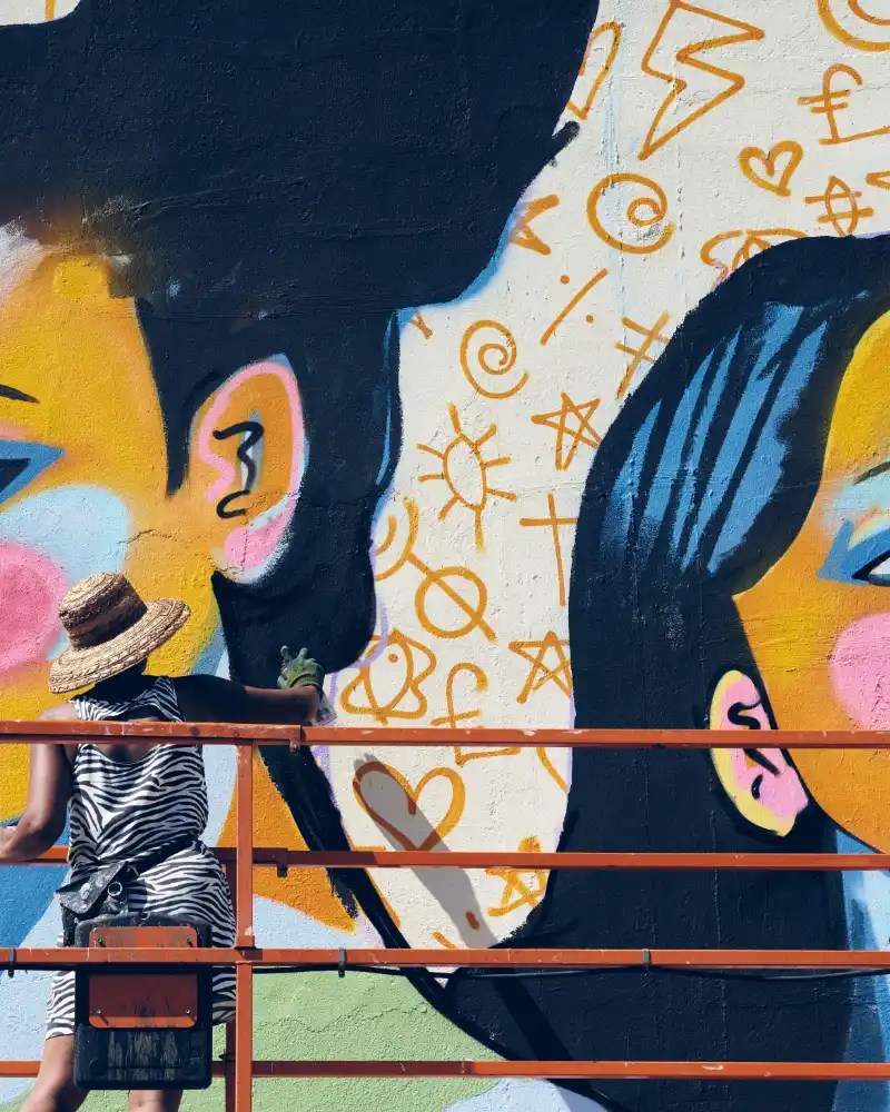 Painted wall with two women.