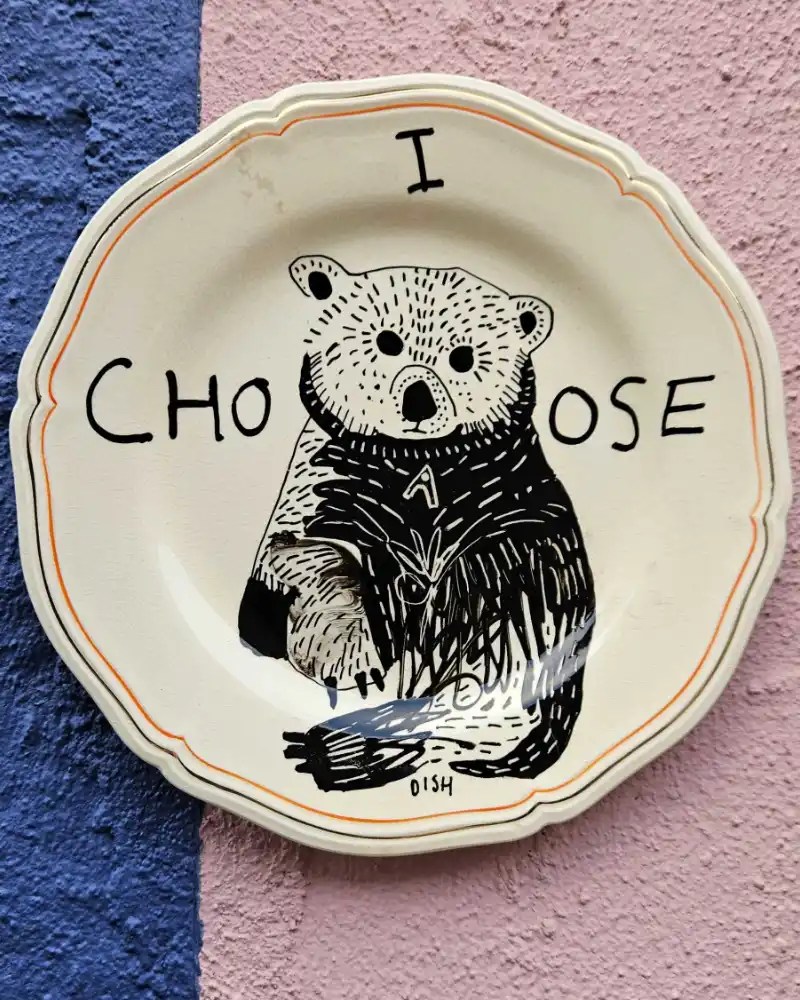 Hand-painted ceramic dish with a bear.