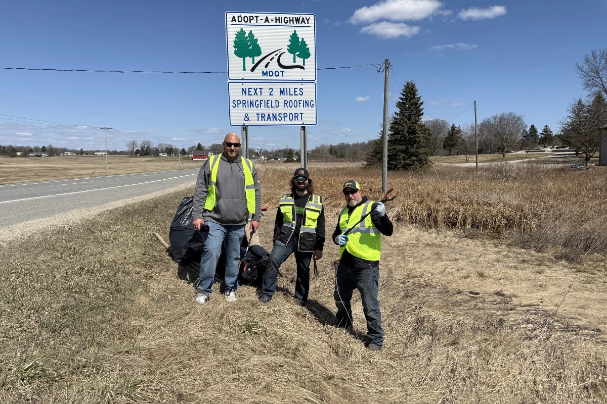 Springfield Roofing team volunteering for Michigan's Adopt-A-Highway program