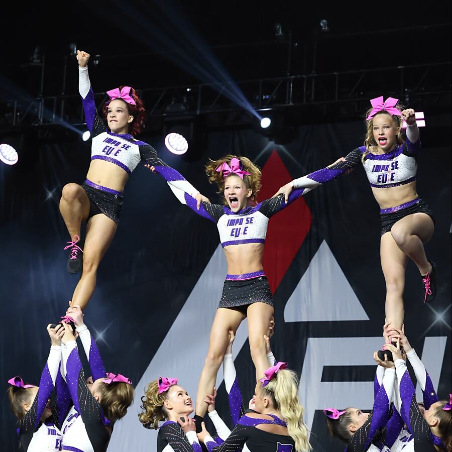 Impulse Elite All Star Cheer team performing a stunt at competition