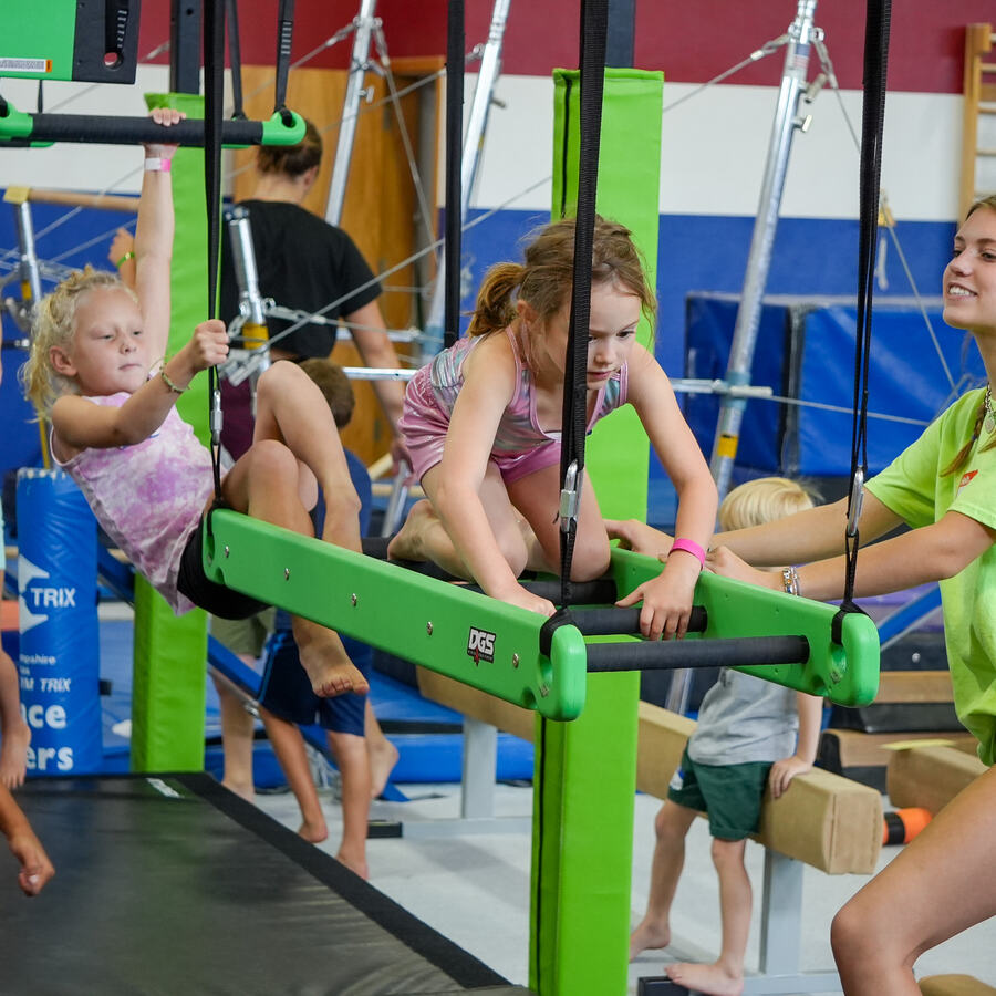 Young ninja athlete climbing an obstacle on the Bailey's Sports ninja cage