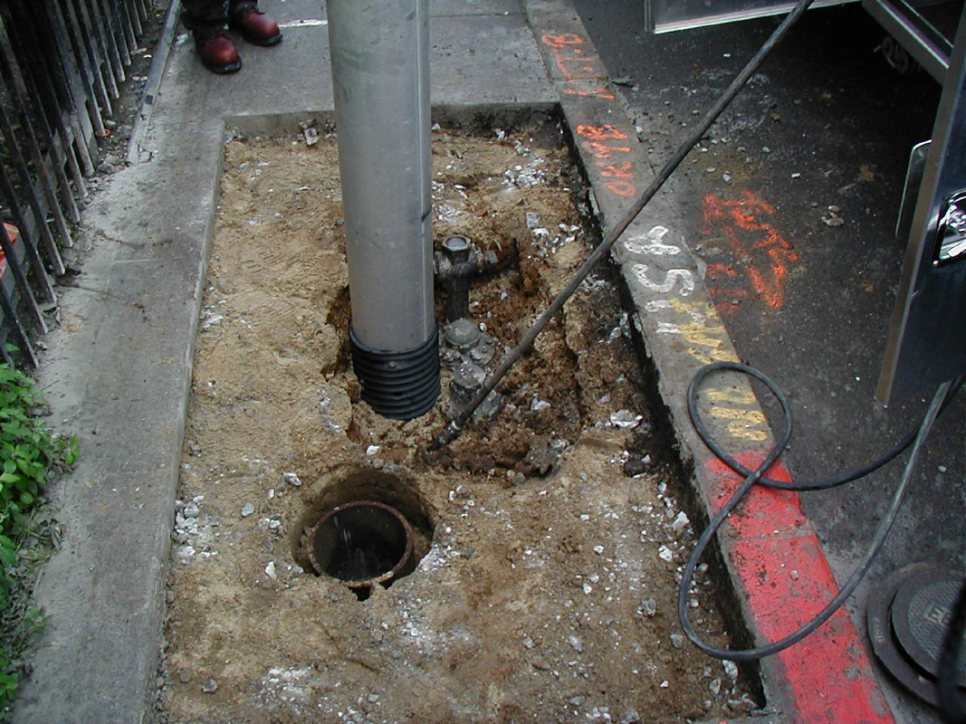 Beginning the careful dig to expose lines.