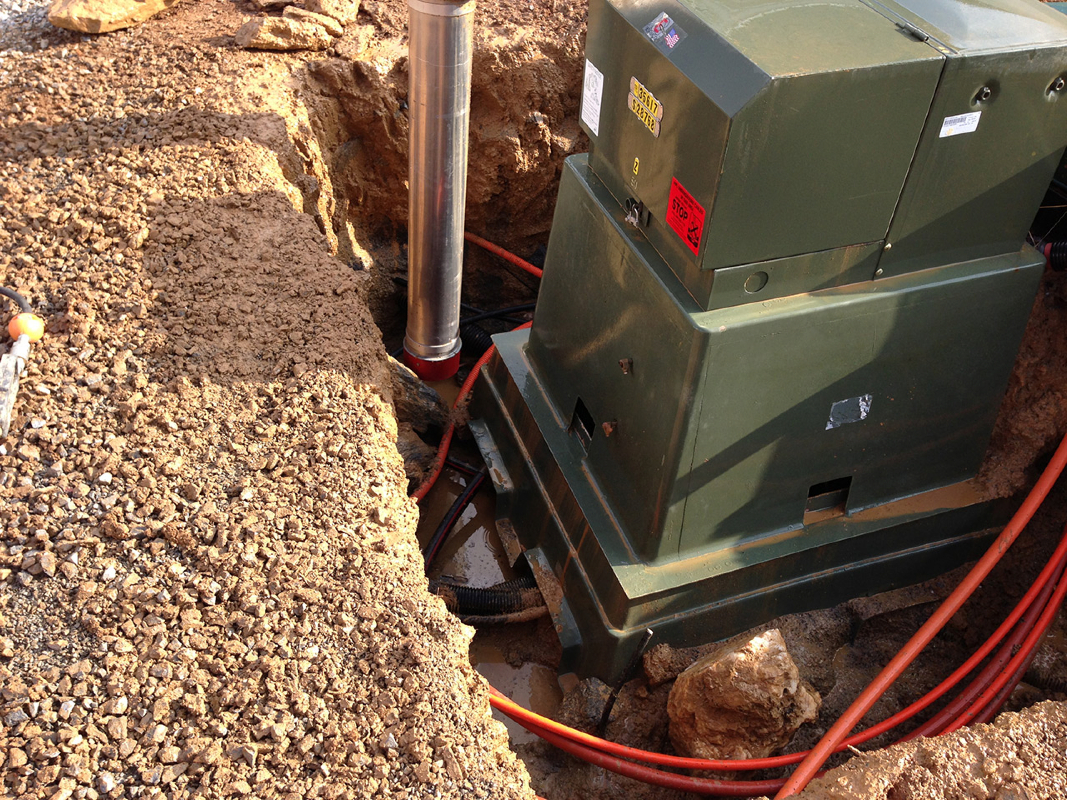 Carefully excavating and exposing utility lines to move transformer.