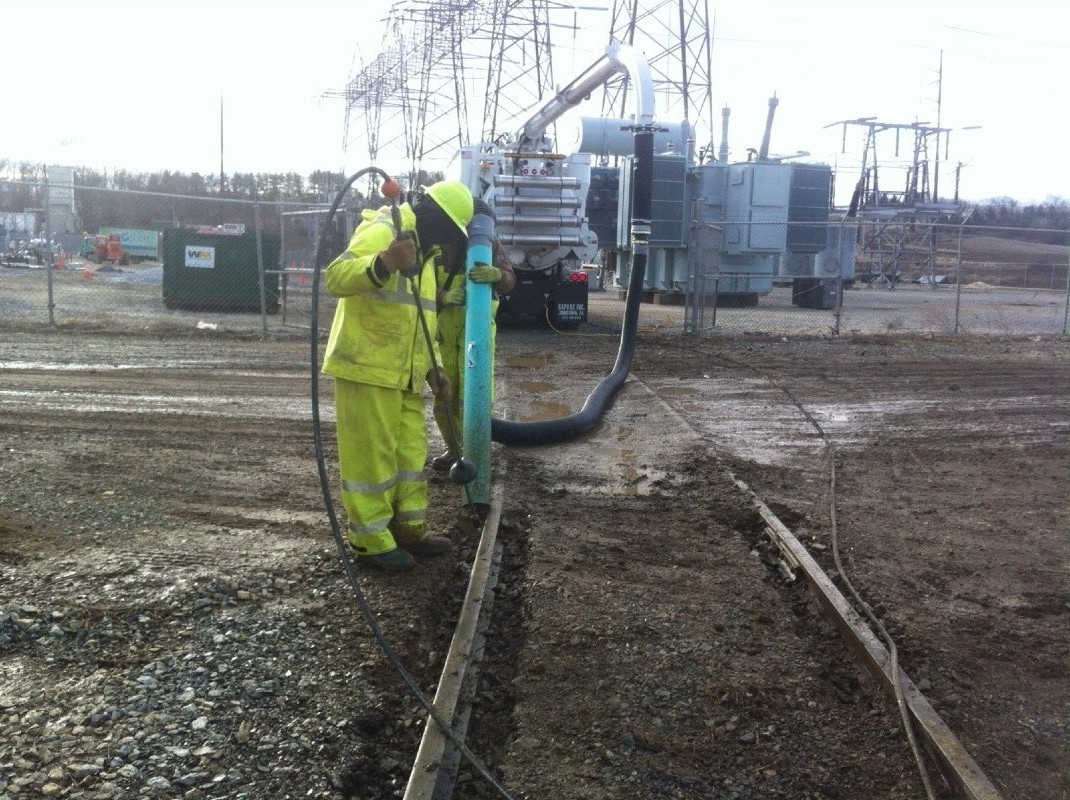 Abandoned train tracks that needed to be excavated along without damage to the track so that electrical equipment could be delivered by rail car