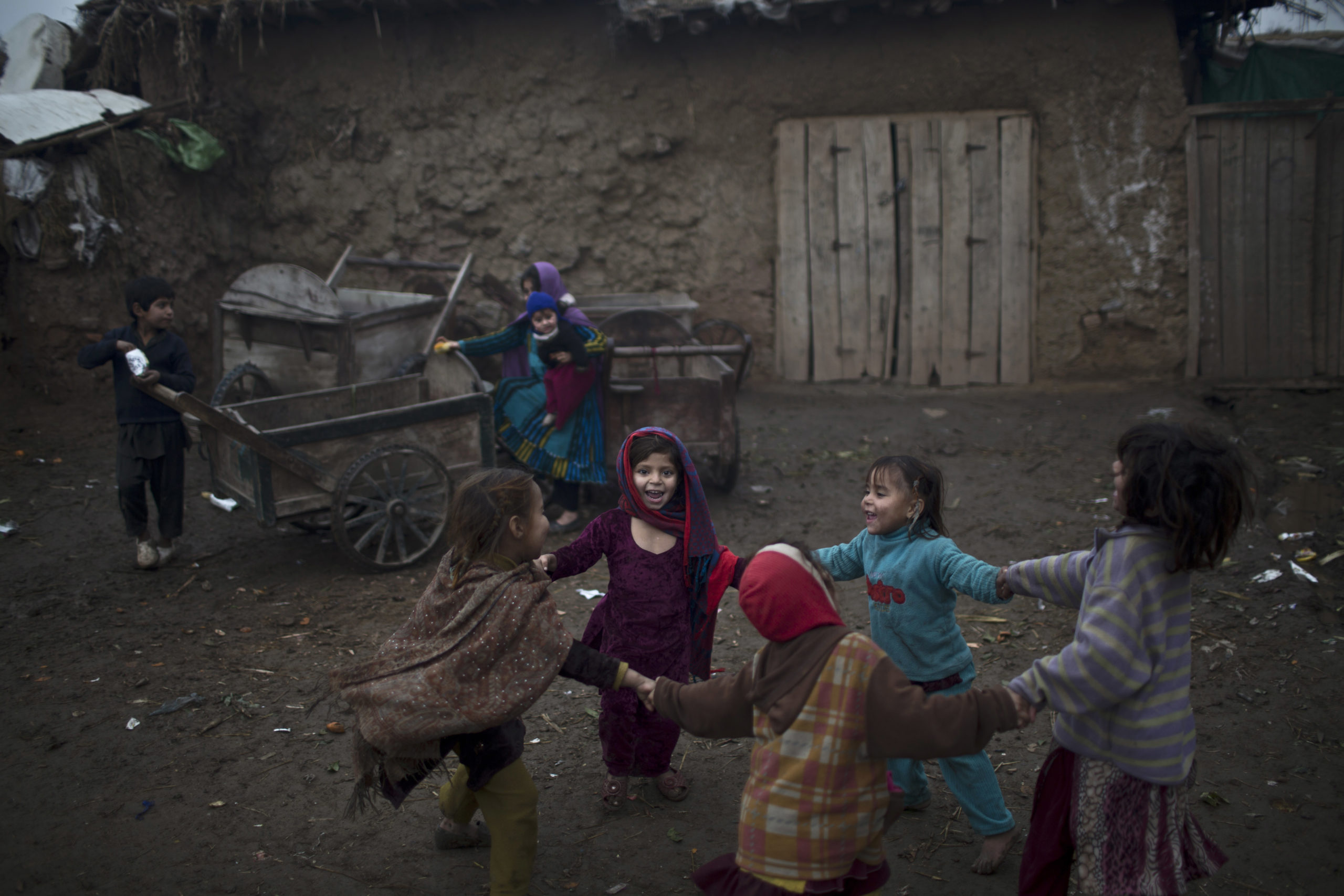 Afghan refugee girls play in a slum on the outskirts of Islamabad, Pakistan.