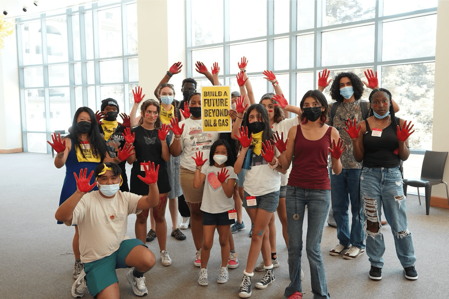 Students with a sign advocating for divestment from fossil fuels