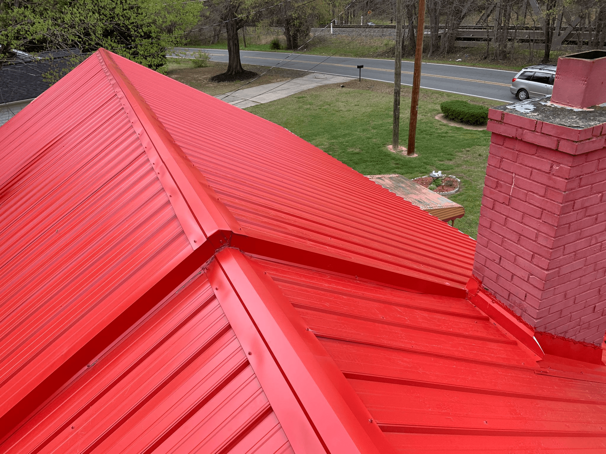 A standing-seam metal roof in red color
