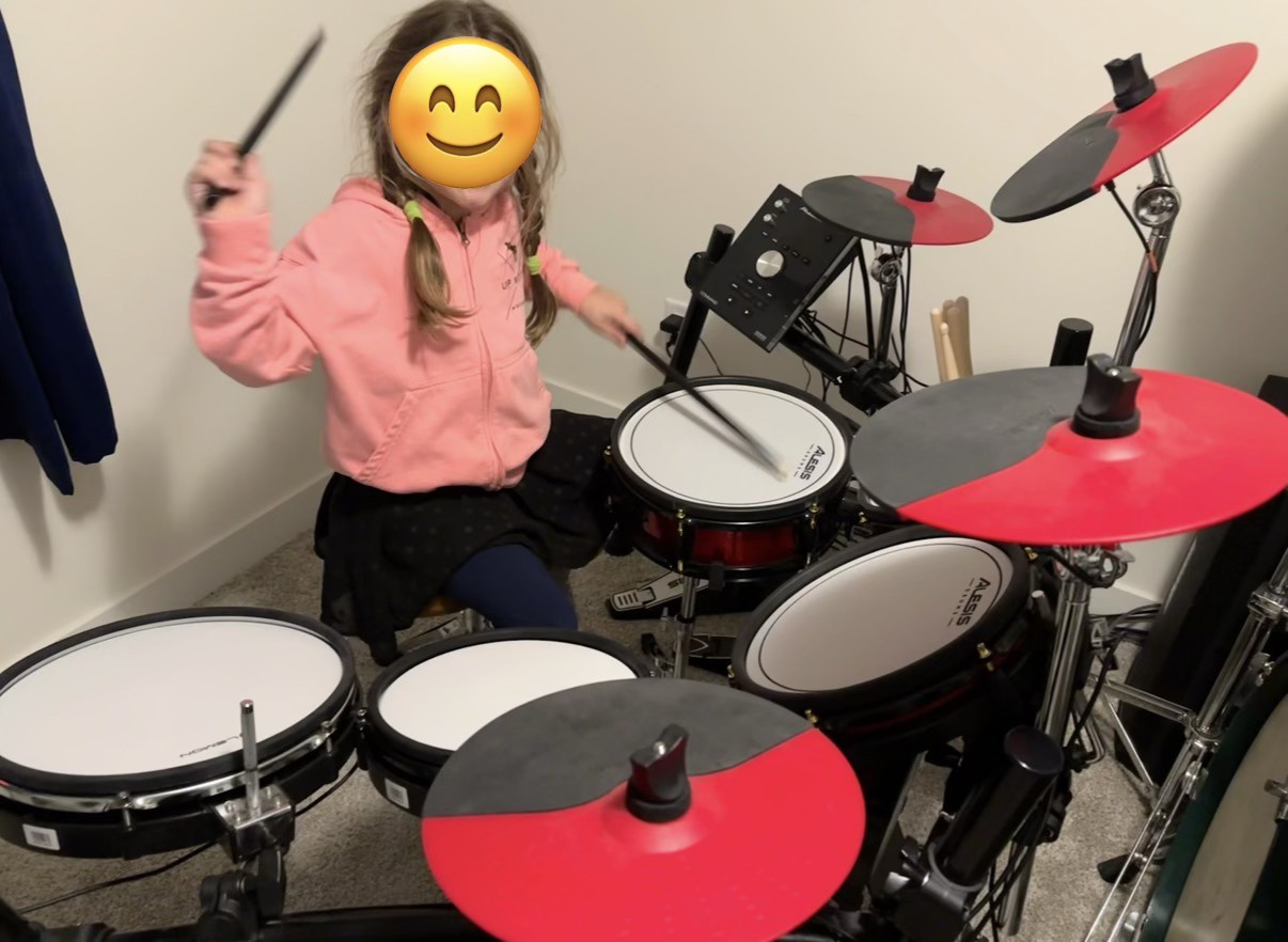 student taking drum lesson