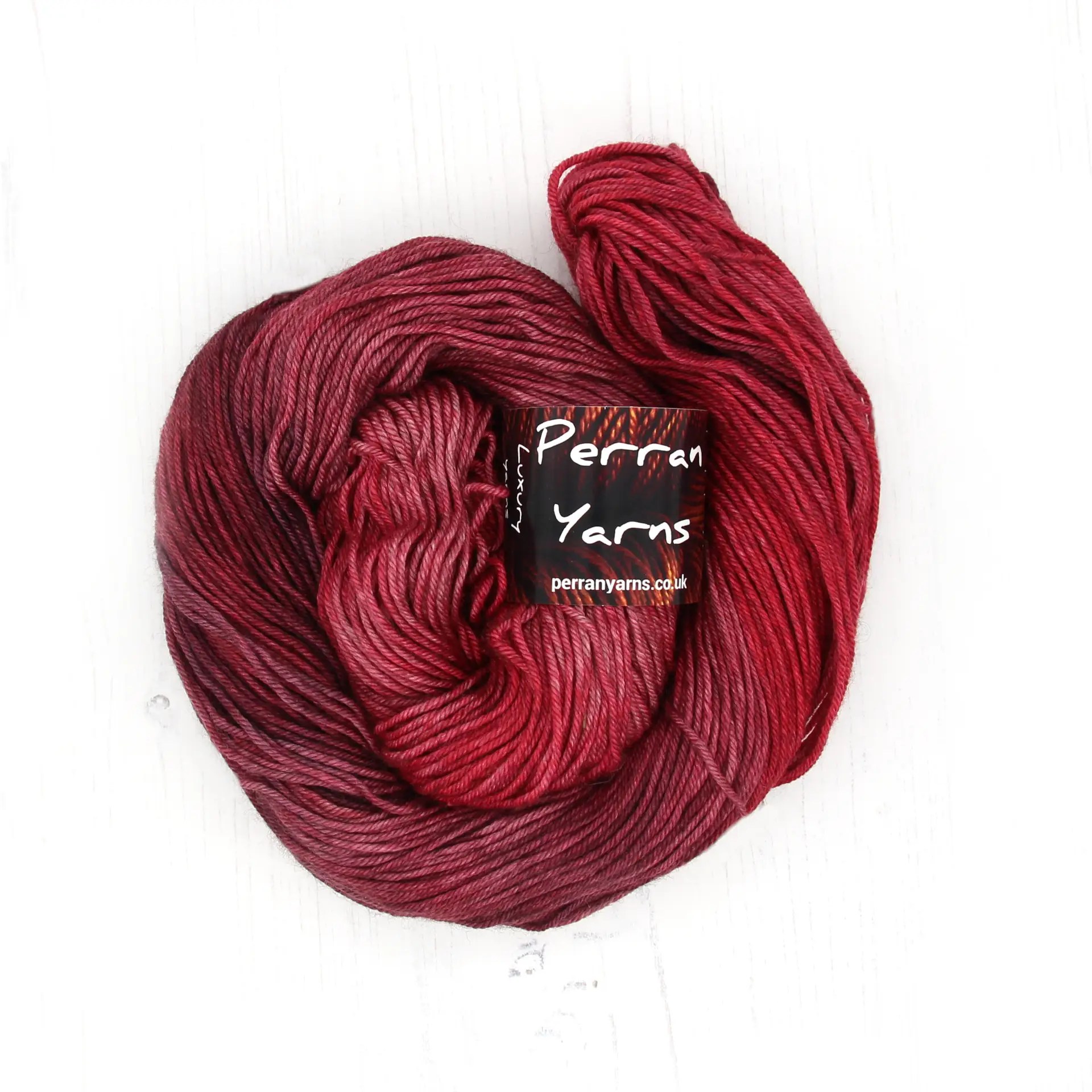 DK Tibetan yarn in hand dyed shade Raspberry Coulis