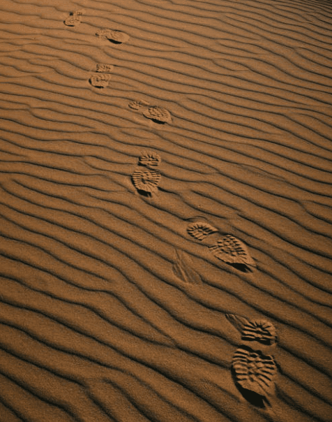 Footprints in sand.