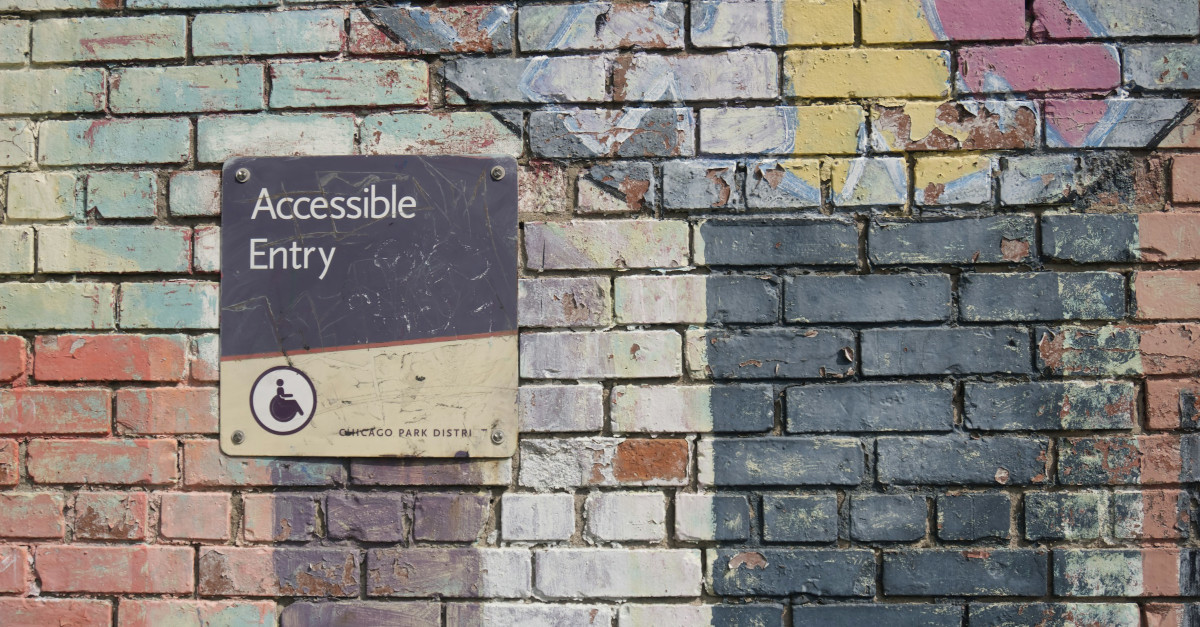 Wall with accessibility sign.