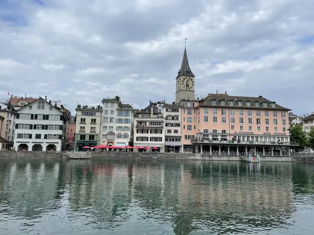 photo of Zurich Switzerland featuring buildings by the lake