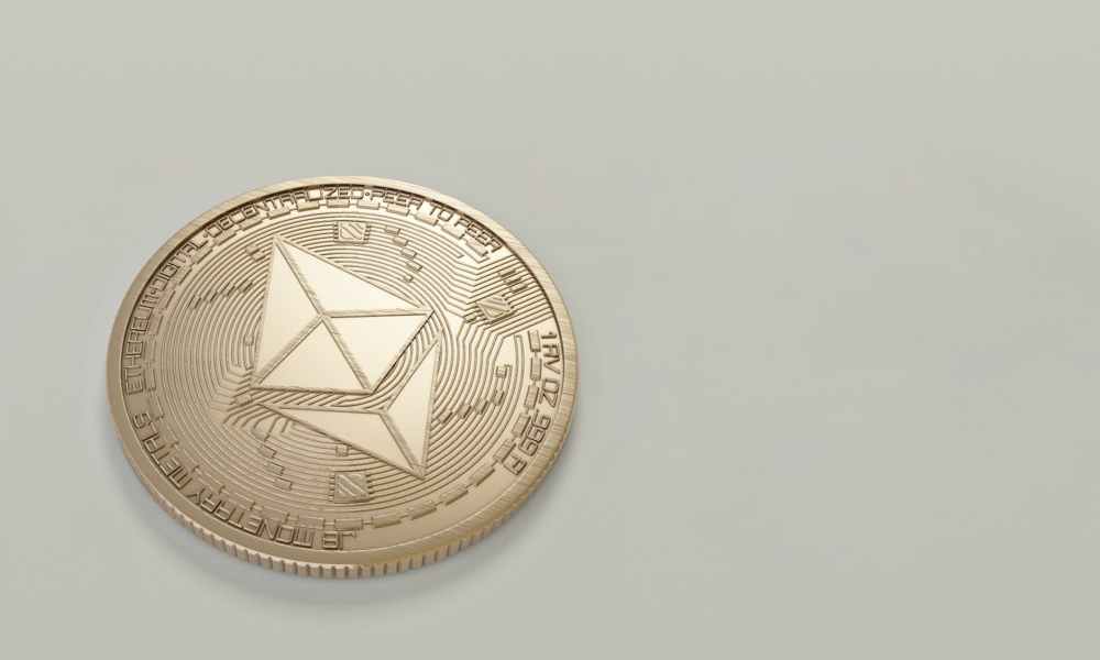 round gold colored ethereum coin