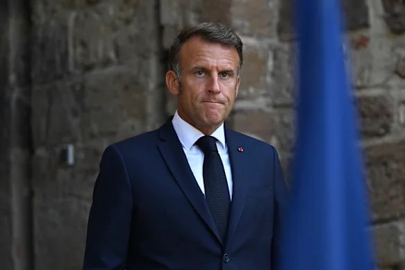 French President Emmanuel Macron wanders alone by the Seine as his grip on power slips away