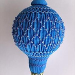 Smocked ornament on a small lightbulb