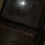 Moonlight through dirty window