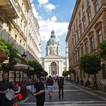 A Cheerful Waiter and a View of Saint Stephen's Basilica