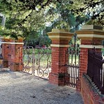 Peterborough. The entrance gates and cast iron wall of the former Catholic Bishops Palace in Peterborough. Built in 1911.