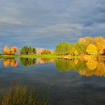 After raining all day, sunshine show up before sunset, the sun beam just like painting pen, make the pond and river, tree with magic color, very special.