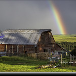 Old truck, rainbow, log barn
