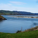 Dunedin. View of Otago Harbour from Taiaroa Headland on Otago Peninsula. Port Chalmers is along the bay.