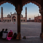 Worshippers and Jama Masjid mosque at dawn - New Delhi, India