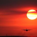 Lockheed C-130 Hercules taking off into the setting sun during Pitch Black 2012 RAAF Exercise, Darwin, Northern Territory, Australia.