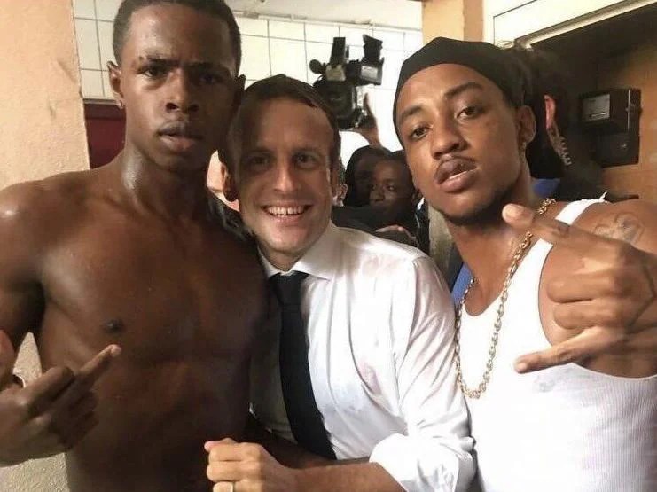 Macron Photographed With Man Making Obscene Gesture The Independent The Independent