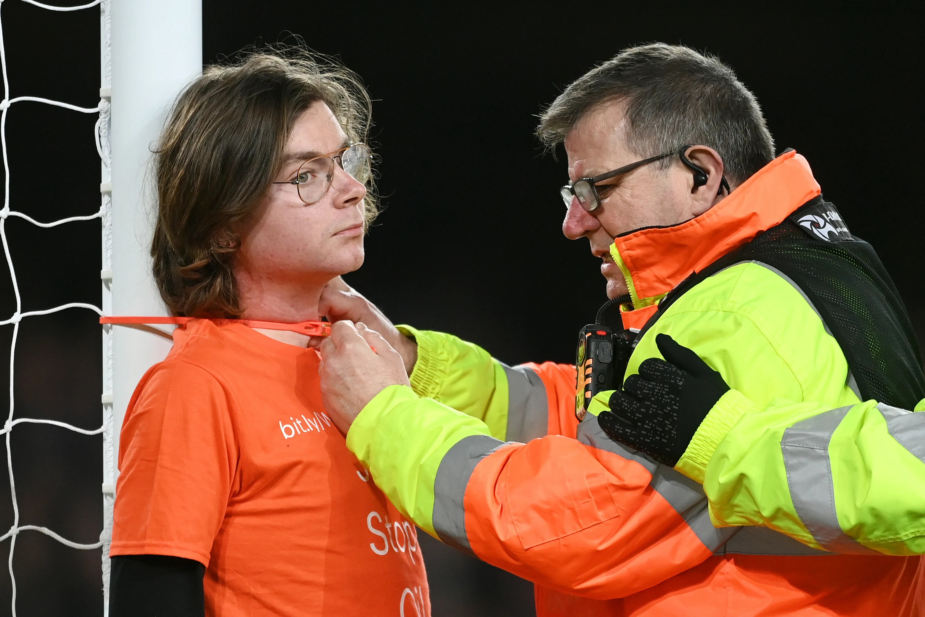 Everton's crunch premier league clash with newcastle on thursday was held up for six minutes when a protester tied himself to one of the . Yfj7fyn5iovzm