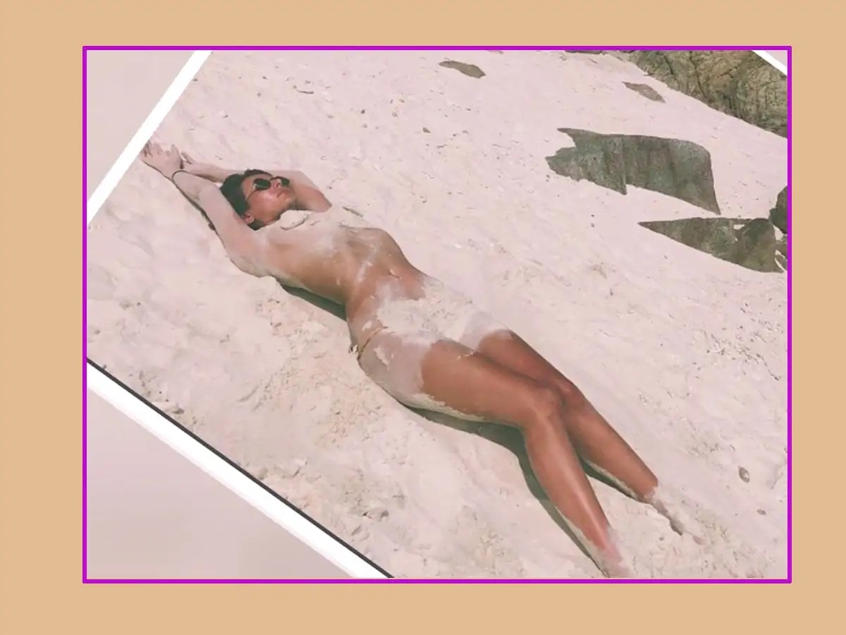 The actress wrote, “Lifes a beach,and Im just playing in the sand...sandba...