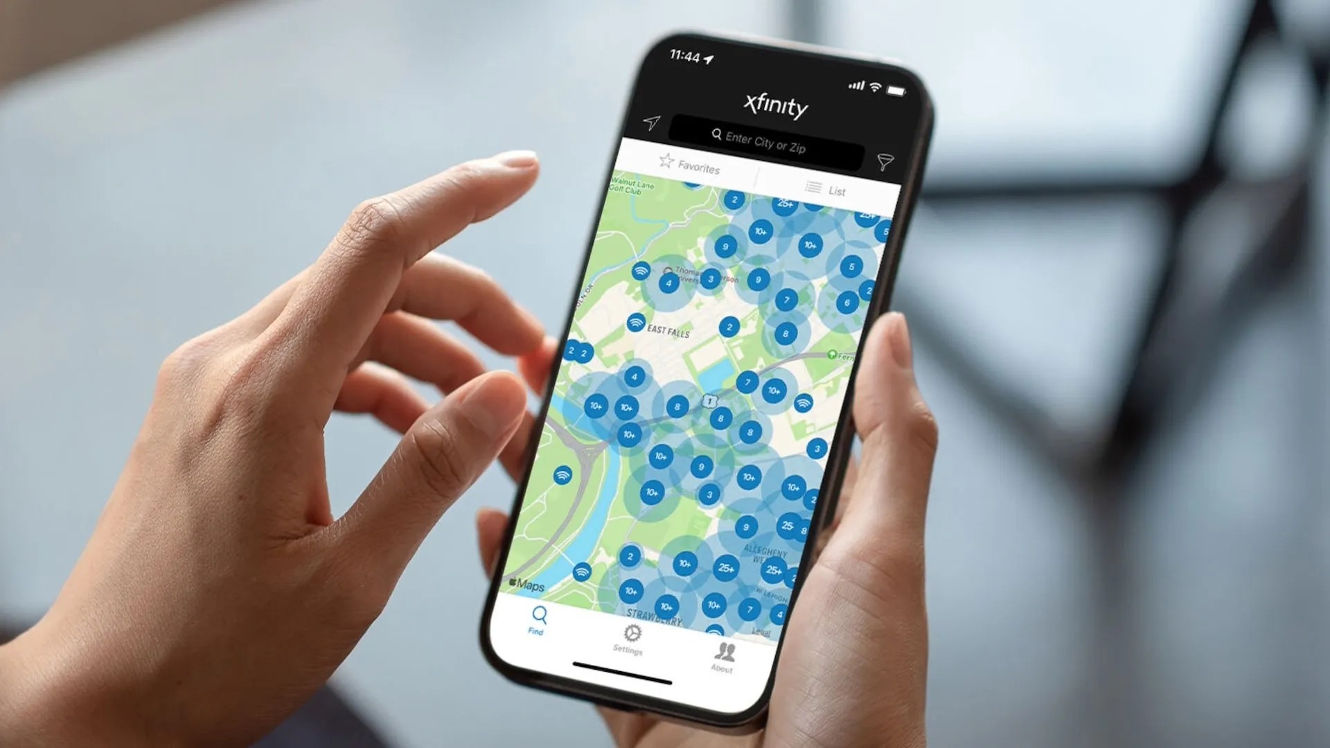 How To See If There Is An Xfinity Outage In Your Area Hand Holding Phone With Xfinity App Open 