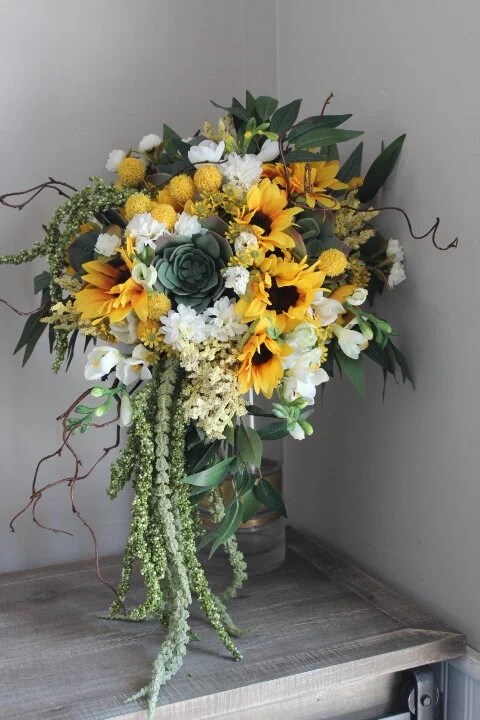 Hold the succulent stem and the floral wire together and wrap with stem wrap to secure. Sunflower Succulent Bouquet Welcome To Buy Ulliyeriscb Com