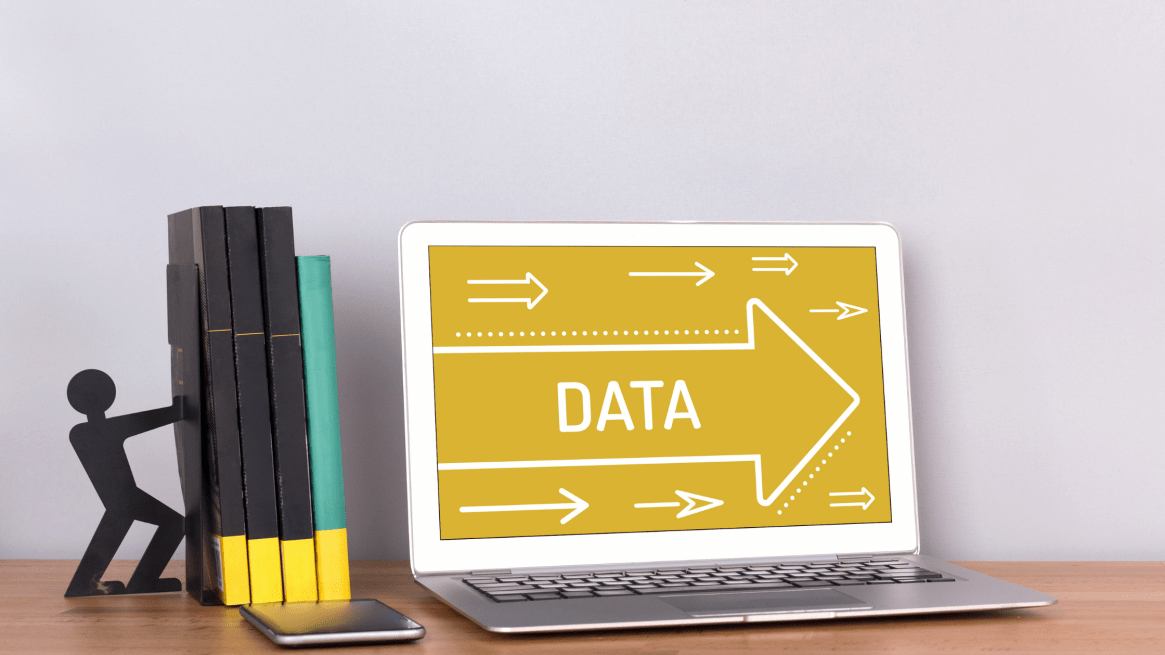 Silver laptop with the word data on the screen