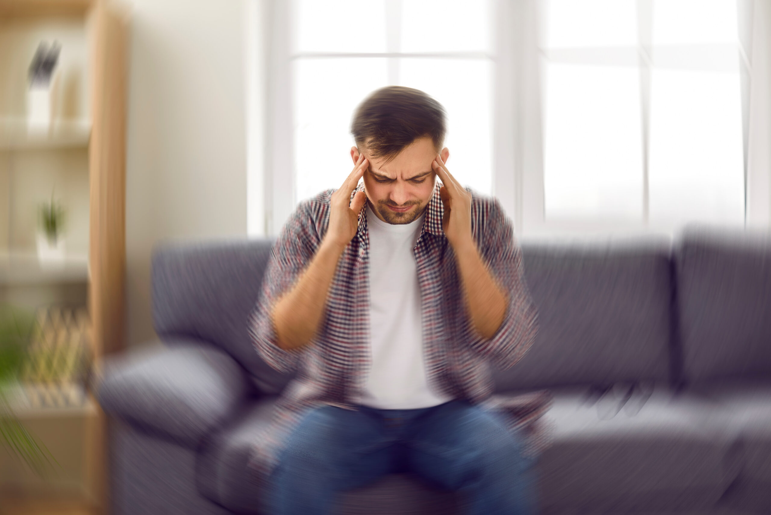 man experiencing vertigo