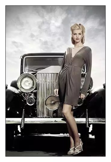 Vintage car and stylish woman for insurance savings.