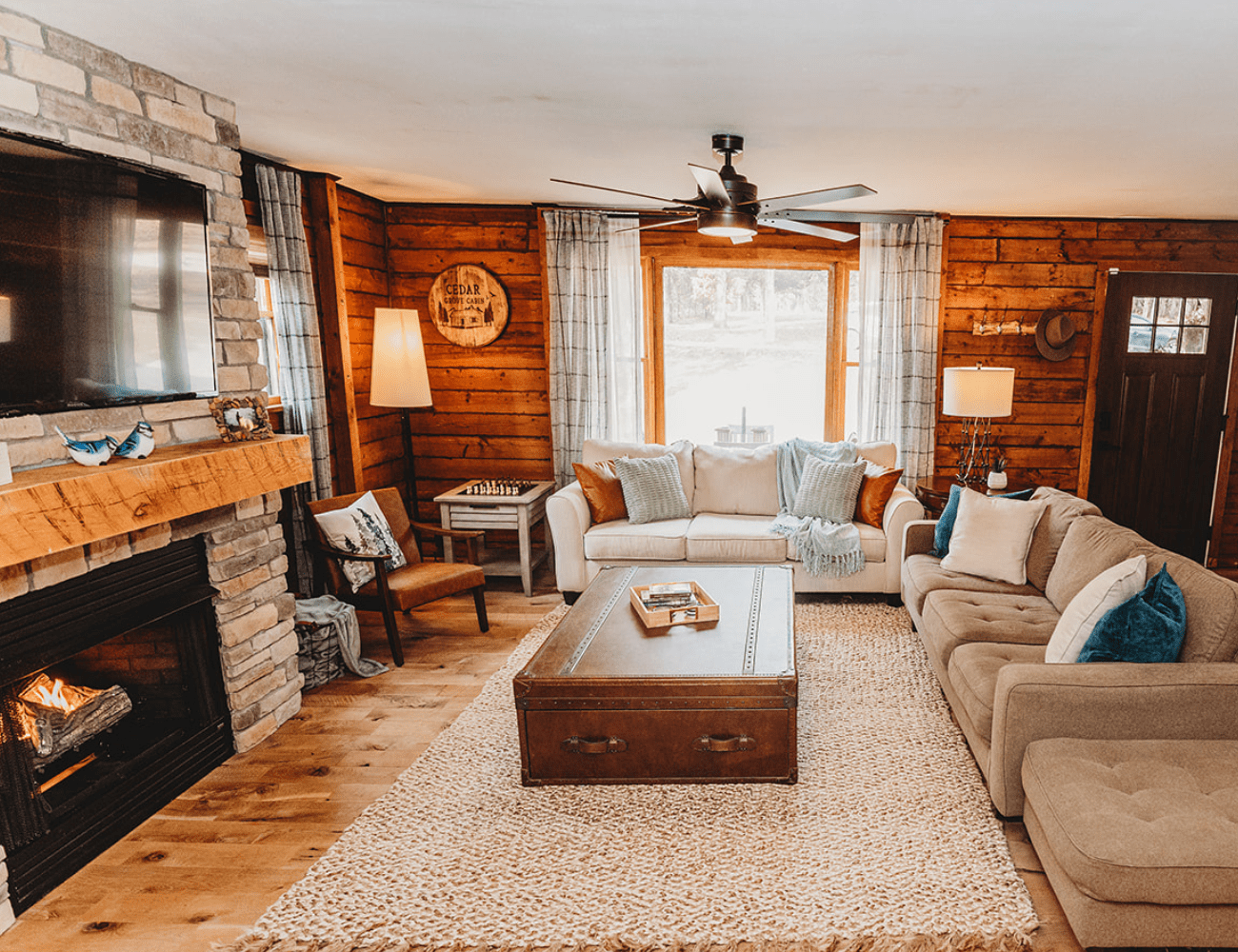 Log cabin living room with comfy sofas and rustic decor