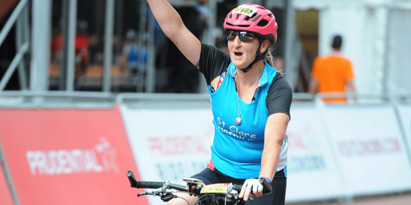 Joanne crossing the finishing line at the Prudential Ride