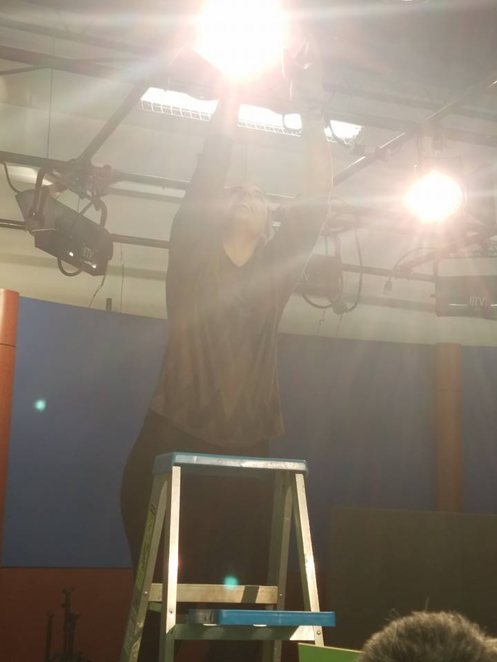 In the TV studio, setting up lights for filming a music video scene.