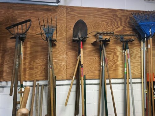 Garden tools hung from the wall