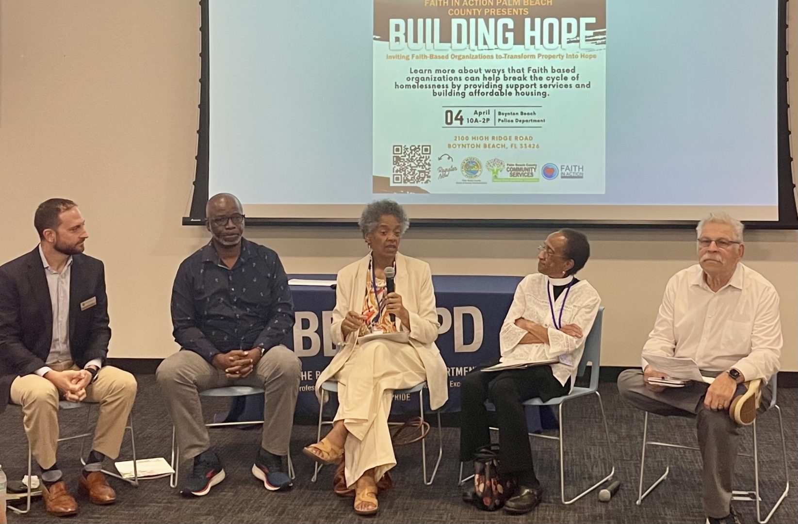 A panel of five people discussing affordable housing.