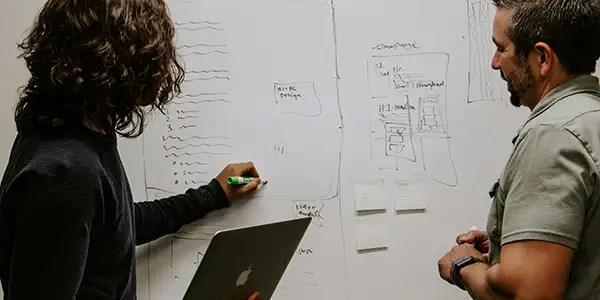 man and woman in office