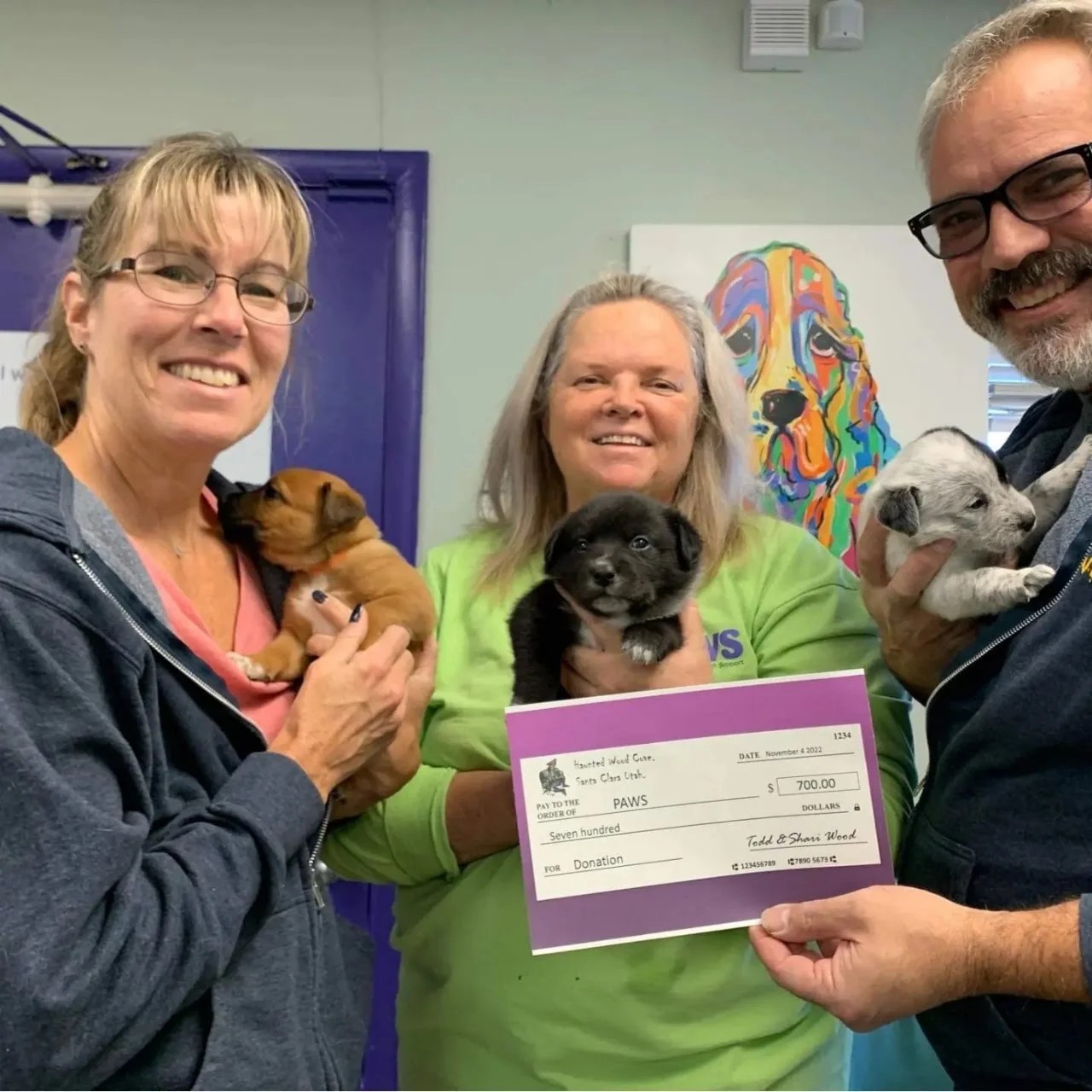 Shari and Todd Wood present a donation check to St. George PAWS